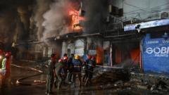 Eight dead, dozens missing in massive Pakistan mall fire